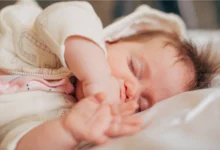 Newborn grunting and squirming while sleeping